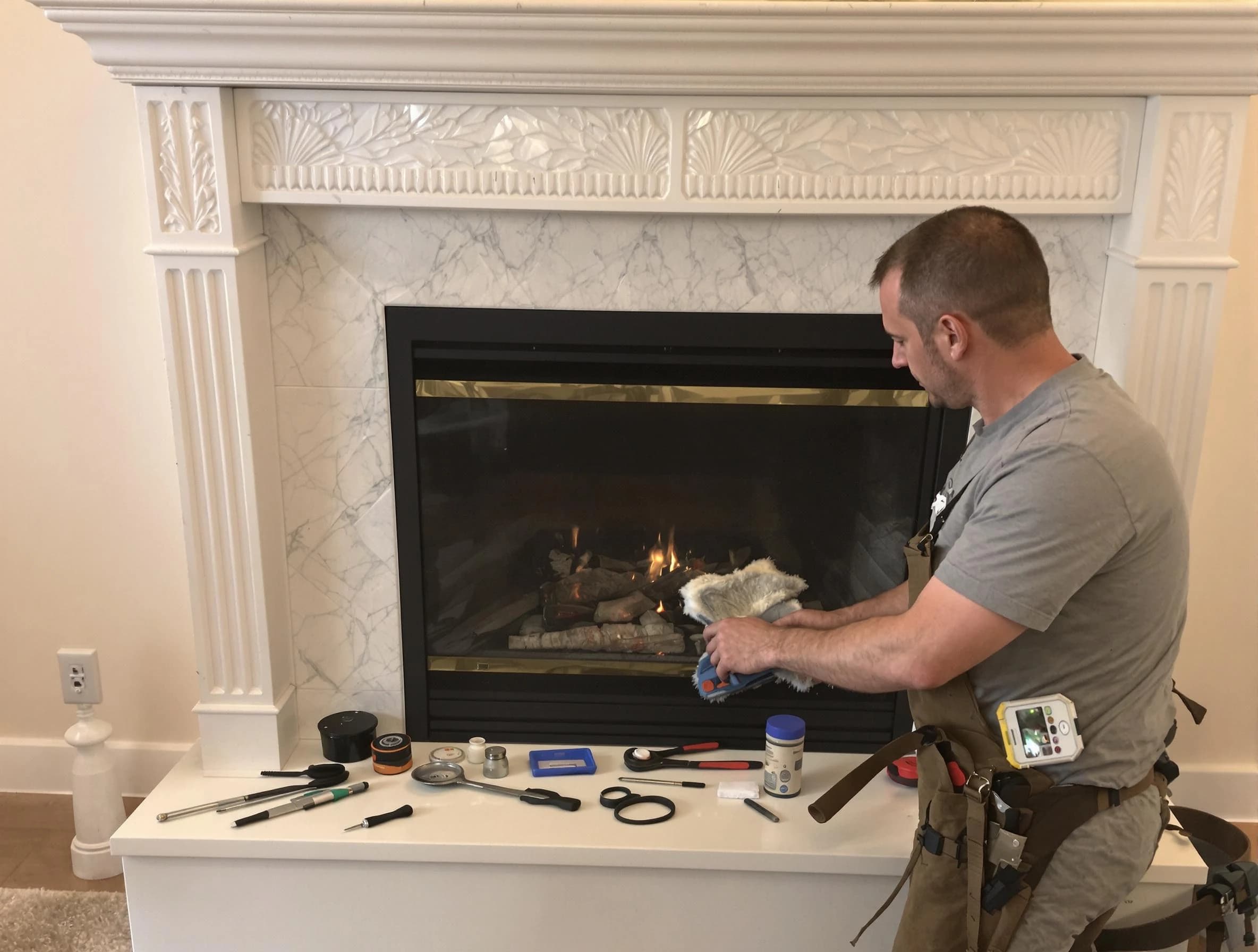 East Providence Chimney Sweep performing fireplace maintenance in East Providence, RI